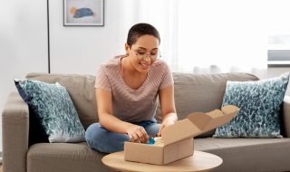 african-american-woman-opening-parcel-box-home_380164-249384 (1)